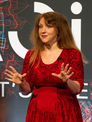 Photograph of Kate Lister presenting at TEDxOpenUniversity in 2019
