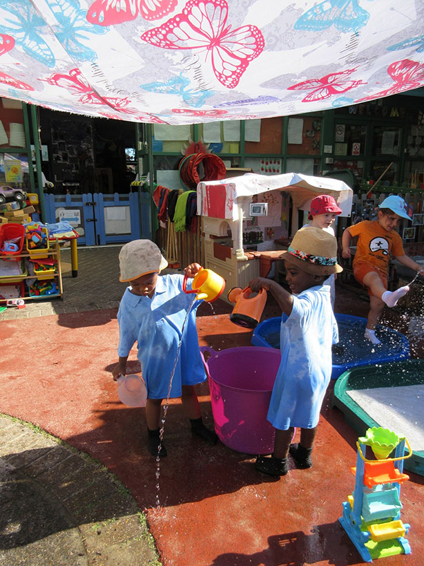 Children playing outside in a nursery