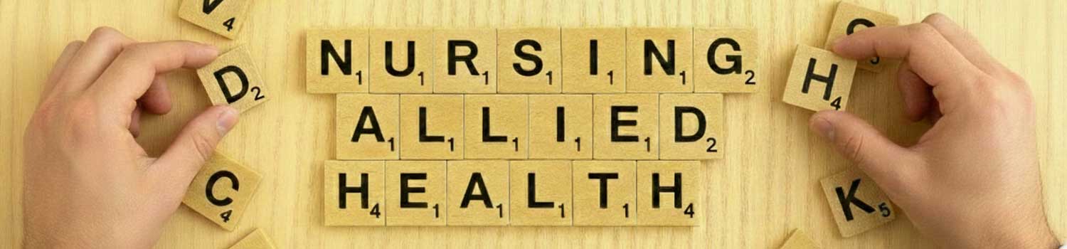 Shot of a young child's arm holding on to an elderly person's hand by the little finger. The older arm wears a brown leather watch with a gold buckle. The background is distorted greenery,