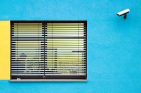 Window with CCTV on blue wall