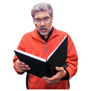 A man stood holding a book