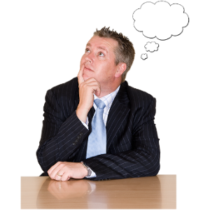 A man in a suit sat at a table with a thought bubble.