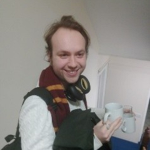 Photo of Nathaniel Lawford holding a coffee mug