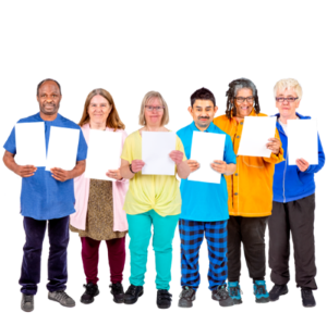 A group of people stood together with blank cards in their hands