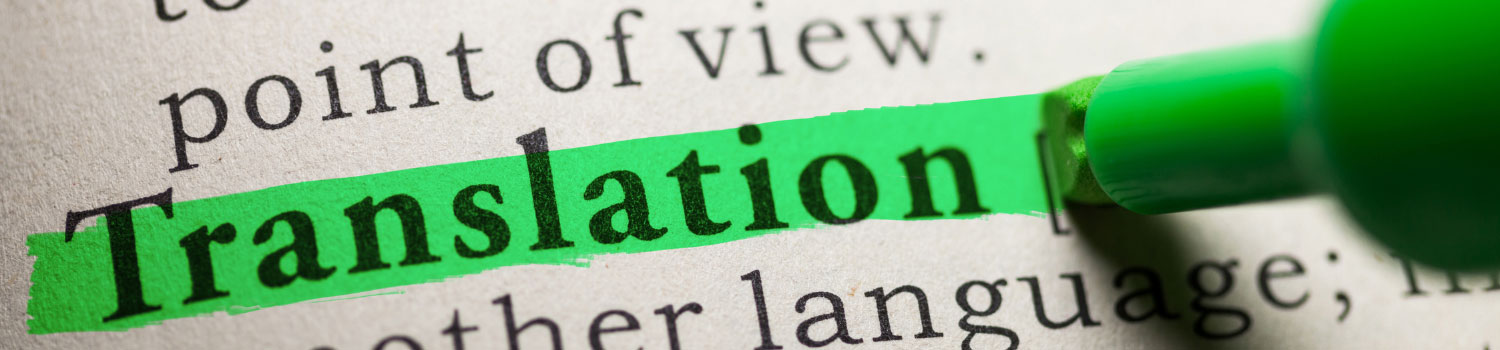 a close up of a dictionary, with the word 'translation' highlighted in green