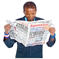 A man reading a newspaper.