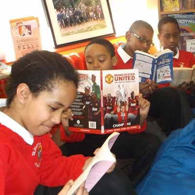 Four children reading books