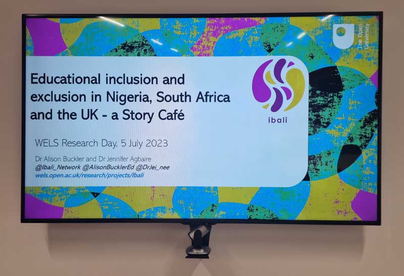 a TV screen showing a presentation slide titled "Educational inclusion and exclusion in Nigeria, South Africa and the UK - a Story Café"