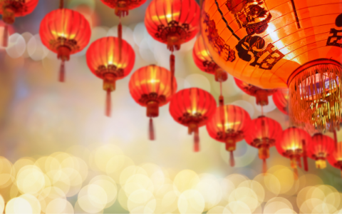 Red Chinese lanterns hang from above