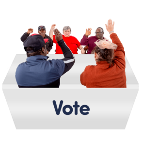 Six diverse individuals are seated around a table labeled 'Vote,' with four people raising their hands, indicating active participation in a voting process. The setting is inclusive and focused on democratic action.